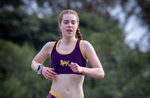 Wesley track stars swap purple and gold for green and gold