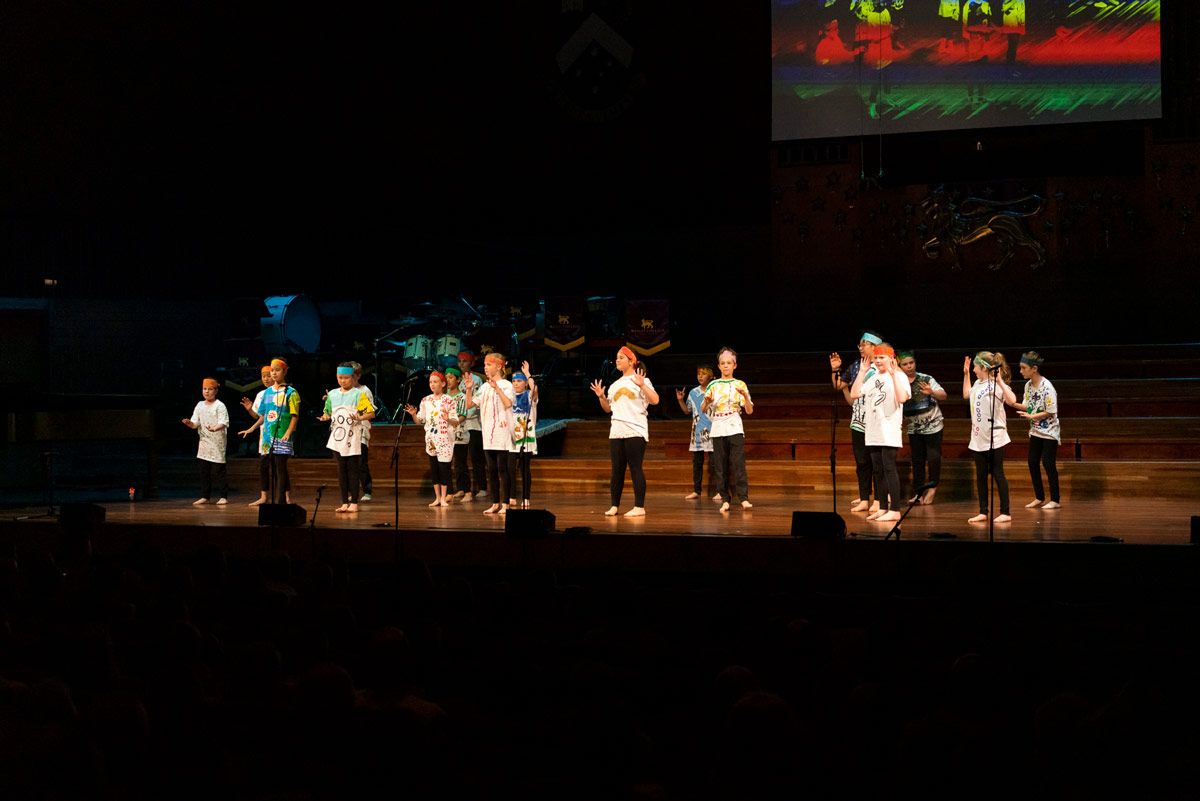 Students dance on stage at the Celebration of the Arts event