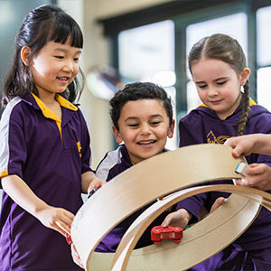 Three students working together on a project