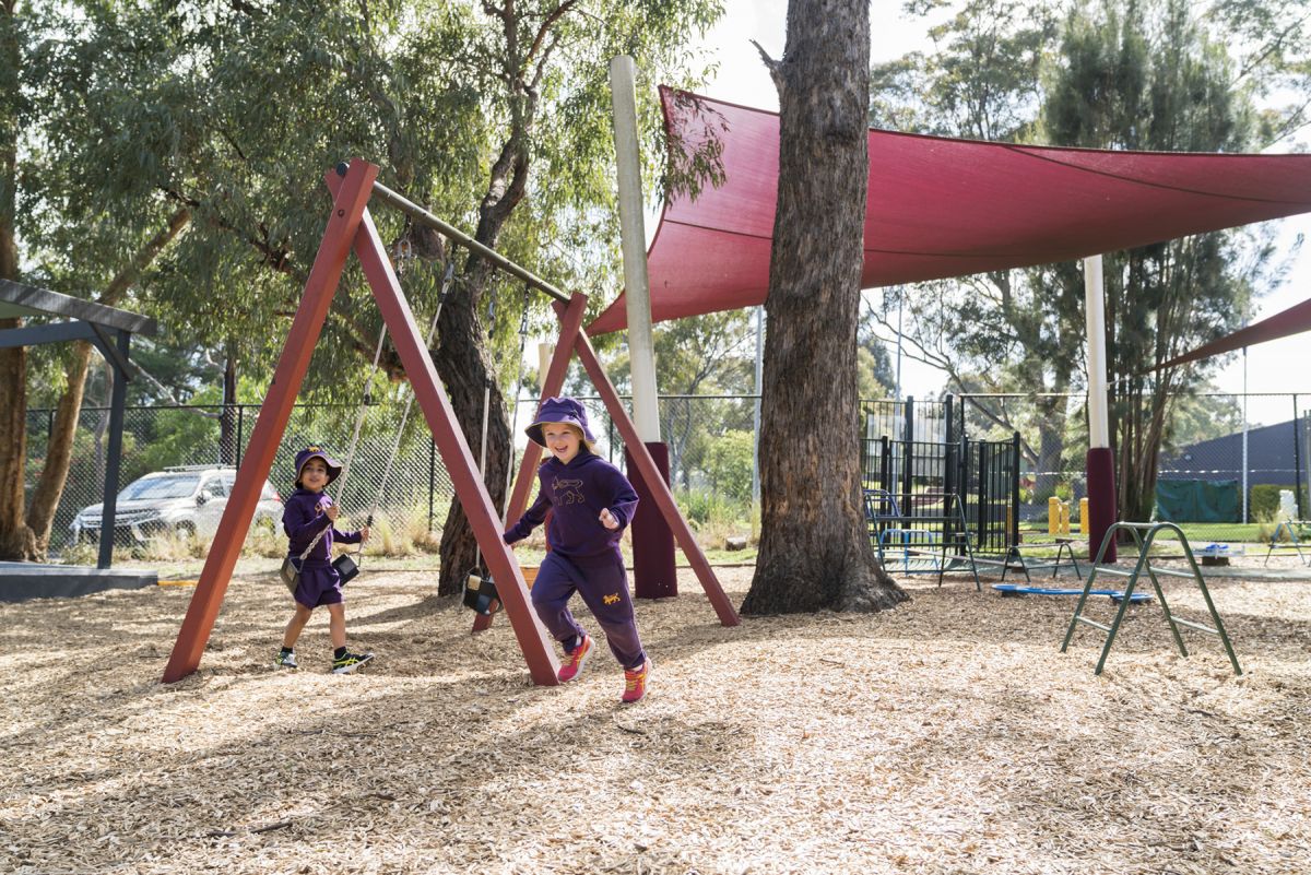 Two children in a learning centre playground