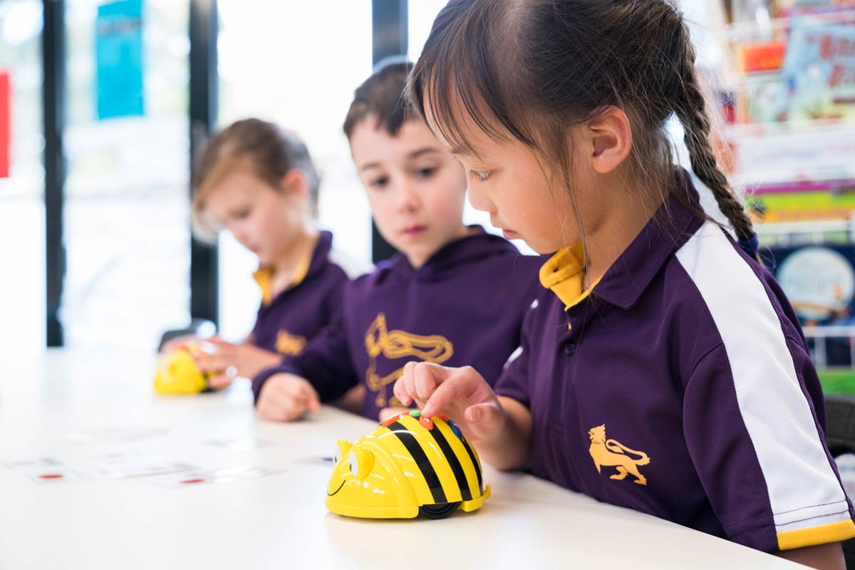 Young children playing with robots