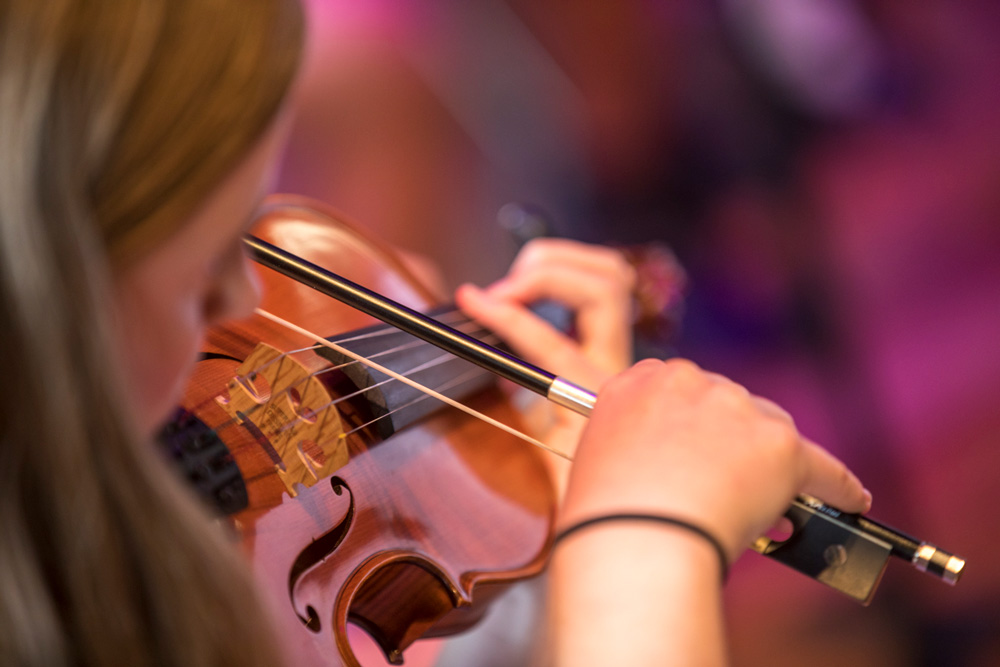 Wesley student playing violin