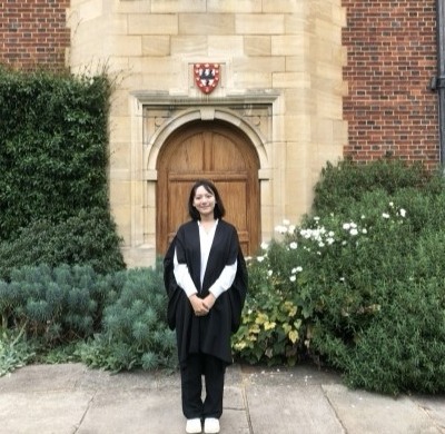 Olivia Zhang (OW2022) standing outside Cambridge University