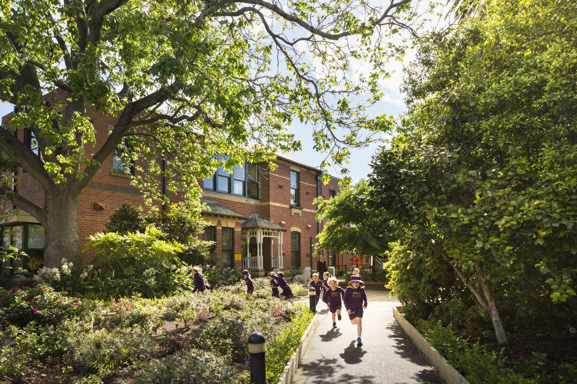 Child running towards the front gate of Elsternwick campus