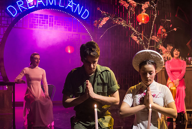 Senior school students onstage performing a play