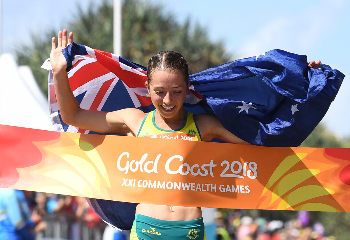 Elite athlete Jemima Montag crosses the finish line at the Commonwealth Games