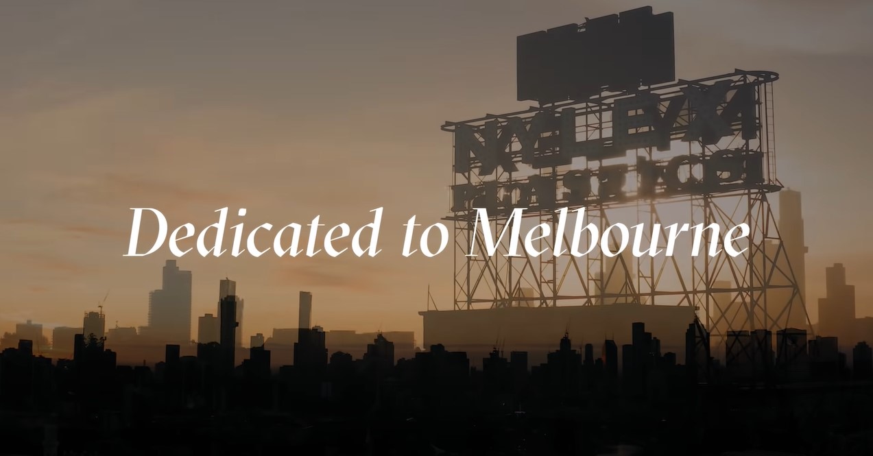 A screengrab from a video by the MSO, showing the words Dedicated to Melbourne over a background of the Nylex clock at sunset