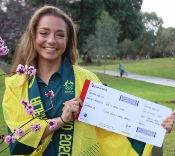 Jemima Montag holds up a mock Qantas plane ticket