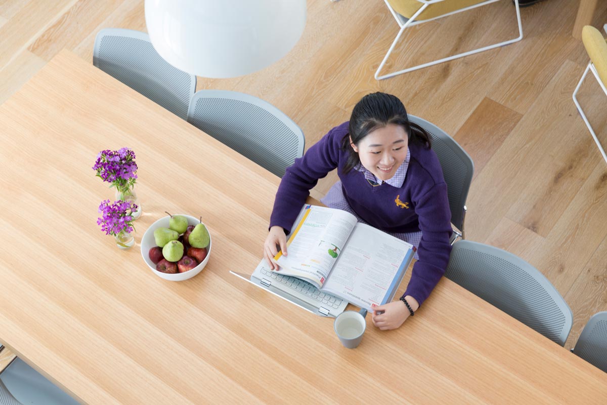 Student studying at the table in Learning in Residence