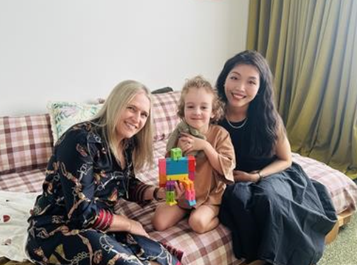 Student with two ECLC educators at home on the couch
