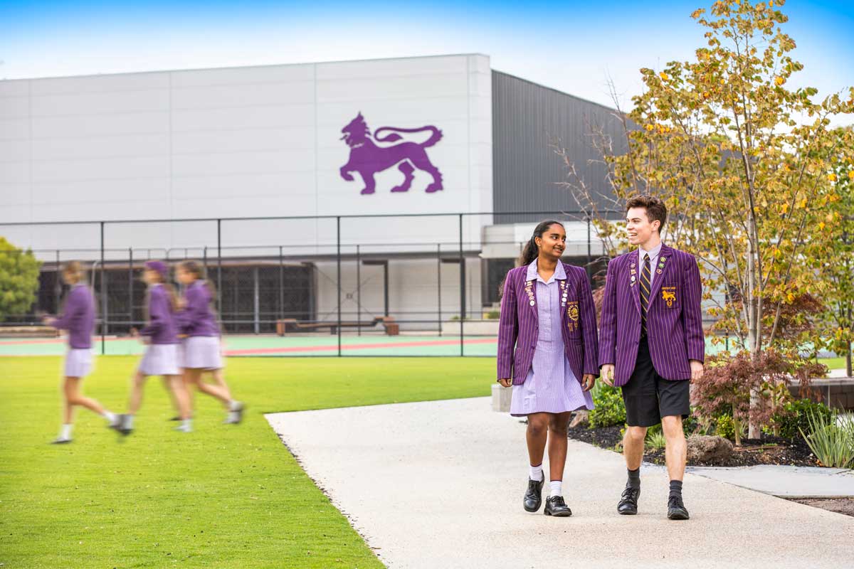 Student leaders Sobi and Dylan walking through the Glen Waverley grounds near the gym